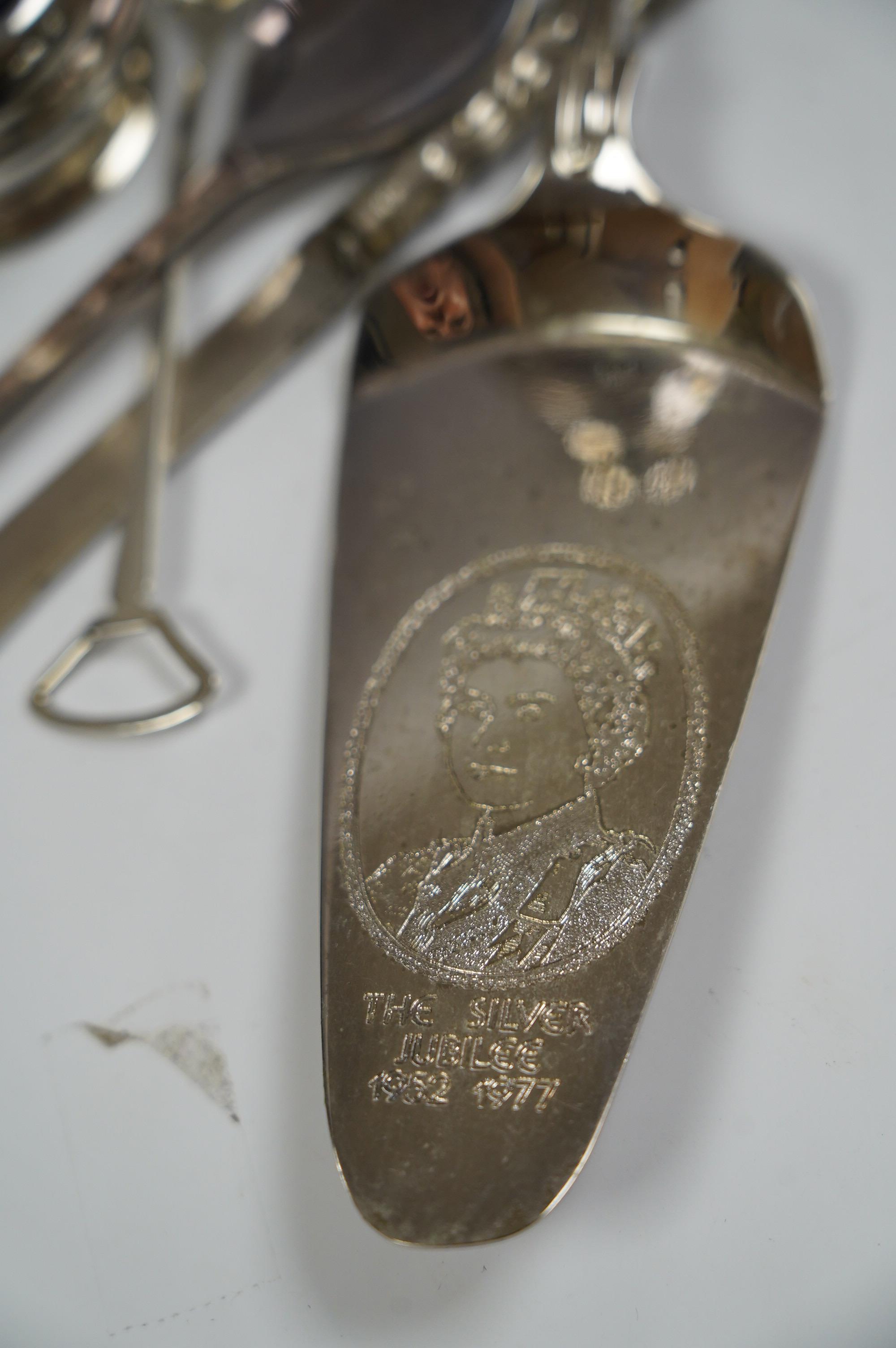 A small group of assorted teaspoons, condiment spoons, small servers, etc. including a Millennium seal top spoon by A. E. Jones Ltd and a Victorian shell bowl ladle by Jehoiada Alsop Rhodes and a silver thimble together